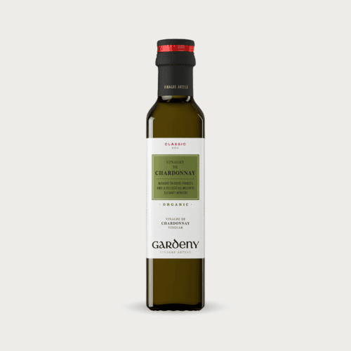Glazen fles Badia Chardonnay wijnazijn voor salades en vismarinades.
